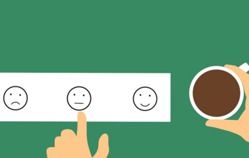Unterschiedliche Smileys; Finger deutet auf den neutralen Smiley
