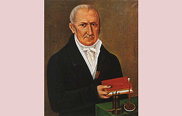 Gemälde: Alessandro Volta neben einem Modell der Volta'schen Säule