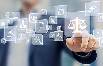 Eingeblendete Icons der Justiz, Finger zeigt auf das Icon einer Waage