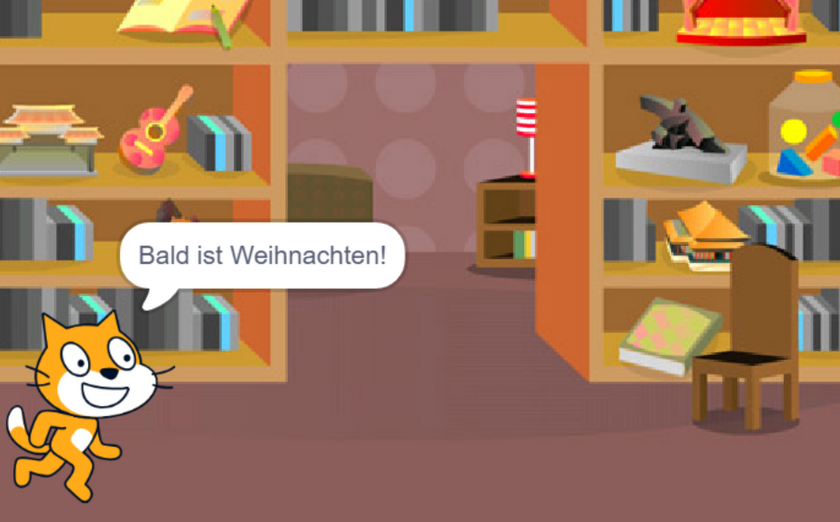 Ein digitaler Weihnachtsgruß auf Scratch. Eine Katze läuft gerade von links ins Bild.